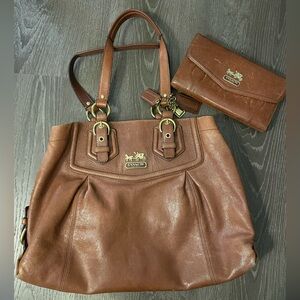 Coach purse and wallet cowhide leather. Minor stain on interior please see photo